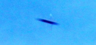 Strange flying creature / UFO sighting on DSLR photography