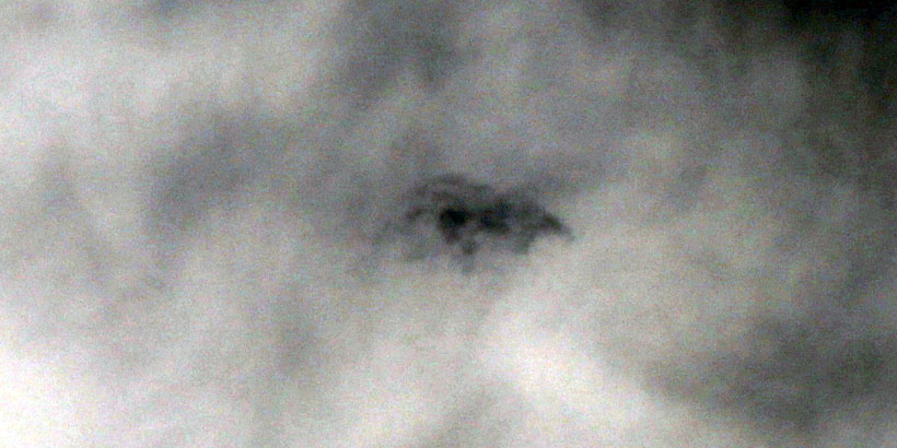 Strange cloud manifestation inside another cloud (negative/auto tone)