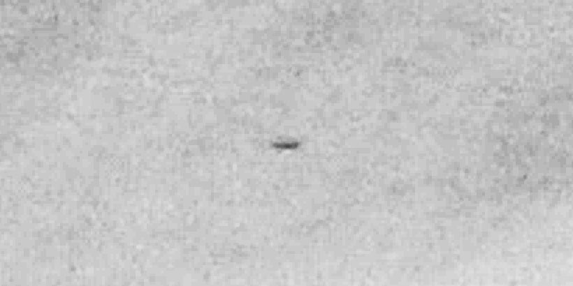 Cylindrical UFO with strange attachments (daylight photo)