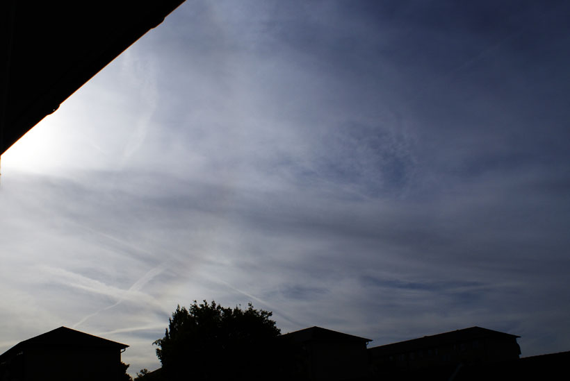 Sun halo and heavy contrail weather photos