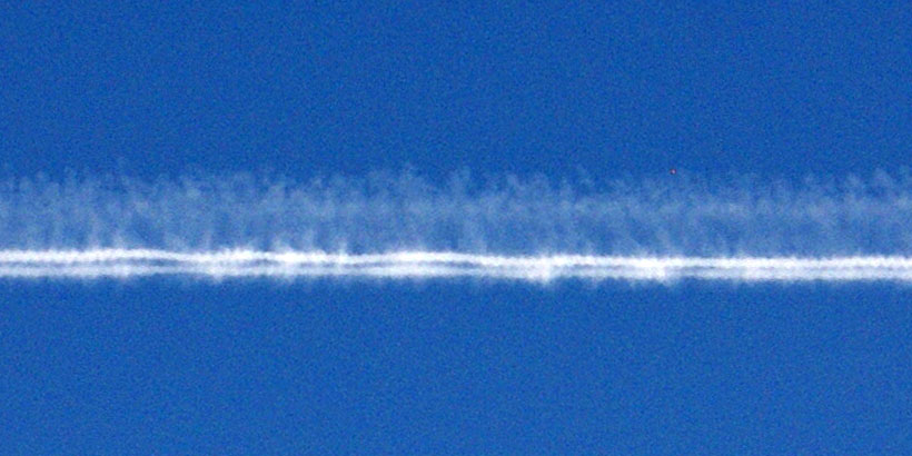 Aircraft contrail with clear jet engine tracks