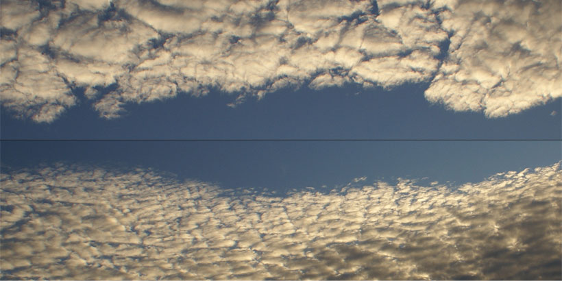 Two types of Altocumulus clouds facing each other