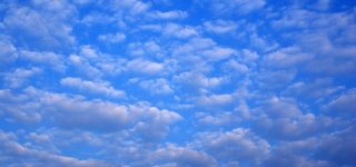 Altocumulus cloud type invading the sky
