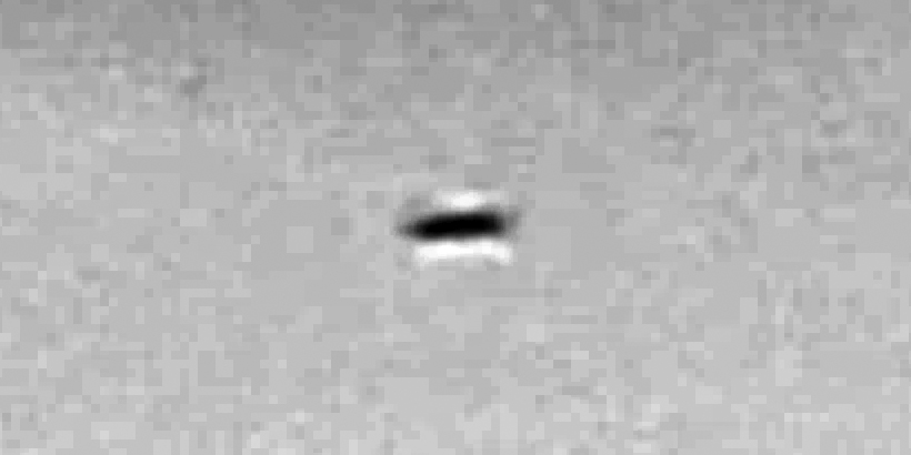 Disc-shaped UFO with strange cloud phenomenon